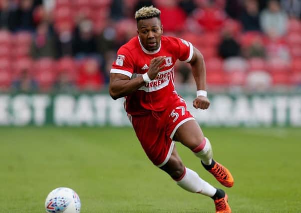 Adama Traore remains 'happy' at Middlesbrough despite interest from Huddersfield Town among others.
