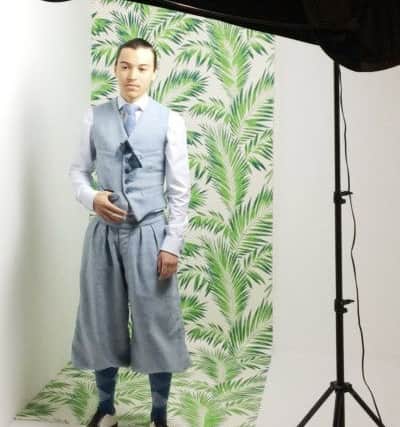 Wearing his own designs is 19-year-old tailor Jools St Armand.