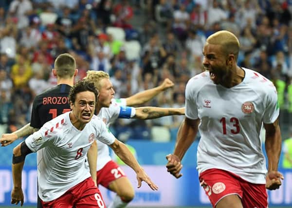 Denmark's defender Mathias Jorgensen (R) celebrates with midfielder Thomas Delaney after scoring the opening goal during the Russia 2018 World Cup round of 16 football match between Croatia and Denmark at the Nizhny Novgorod Stadium. (Picture: Dimitar DILKOFF/AFP/Getty Images)