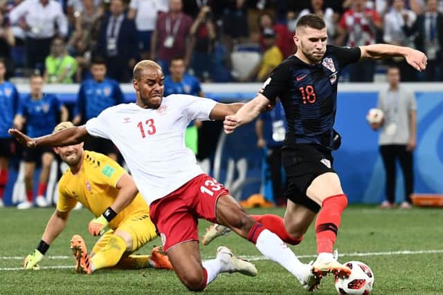 Denmark's defender Mathias Jorgensen (L) fouls Croatia's forward Ante Rebic in the penalty area (Picture: JEWEL SAMAD/AFP/Getty Images)