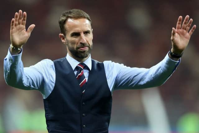 England manager Gareth Southgate walks back out onto the pitch after the FIFA World Cup semi-final