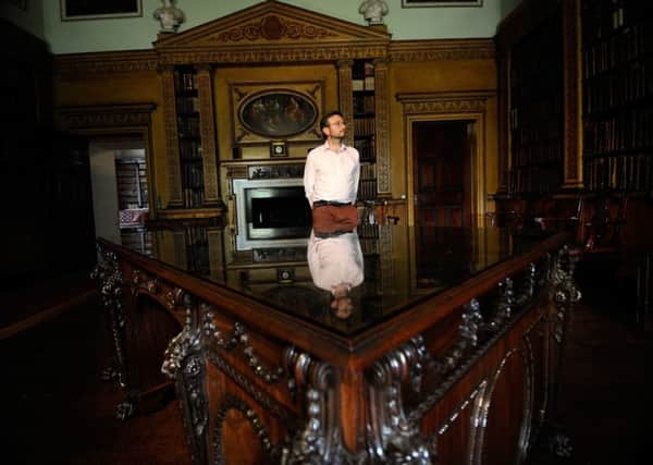 Curator Simon McCormack with the Library Desk by Thomas Chippendale at Nostell Priory. PIC: Simon Hulme