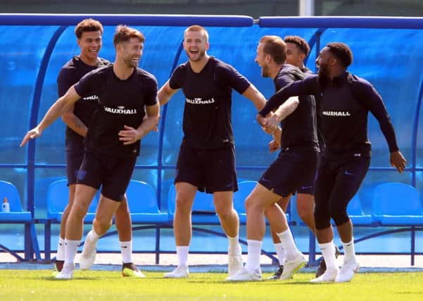 England players, l-r, Dele Alli, Gary Cahill, Eric Dier, captain Harry Kane, Jesse Lingard and Danny Rose share a jovial moment in training at Zelenogorsk Stadium on Friday (Picture: Alexander Hassenstein/Getty Images).