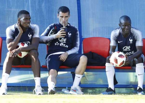 FINAL COUNTDOWN: France's Paul Pogba, Antoine Griezmann and Ngolo Kante take a breather during a training session. Picture: AP/David Vincent)