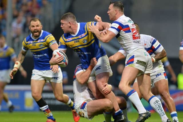 Leeds Rhinos' Mitch Garbutt looks for the pass in Friday night's clash with Wakefield Trinty. Picture: Bruce Rollinson