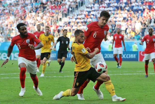 Belgium's Eden Hazard (centre) and England's Harry Maguire (right) battle for the ball during the FIFA World Cup third place play-off match at Saint Petersburg Stadium. (Picture: Aaron Chown/PA Wire)