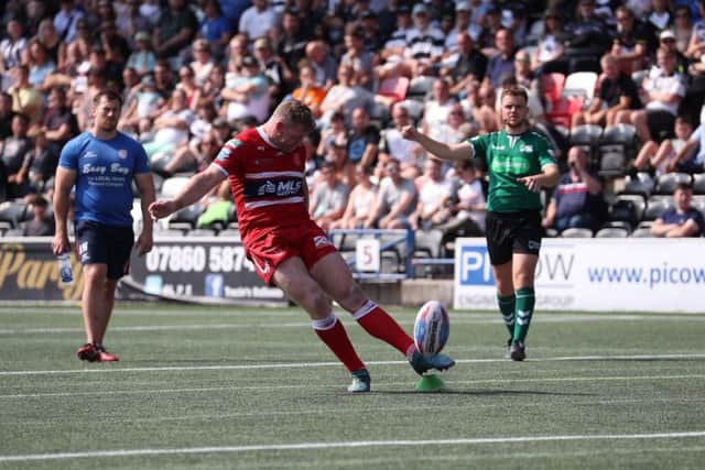 Hull KR's Danny Tickle kicks the points against Widnes