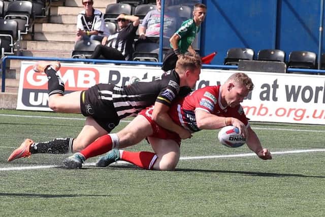 Danny Tickle crosses the line for Hull KR at Widnes.