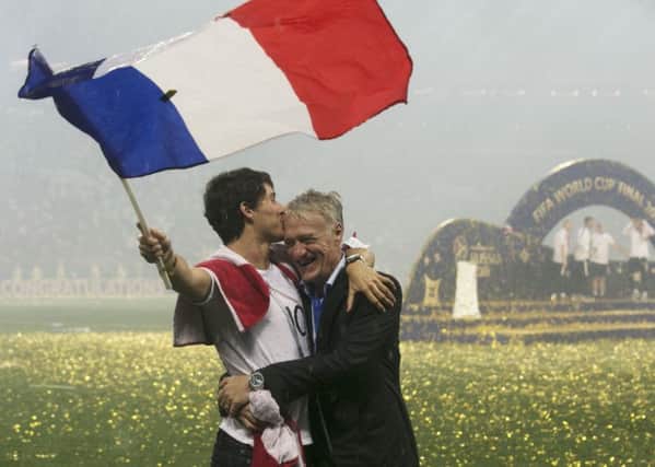 France head coach Didier Deschamps (right) and son Dylan Deschamps celebrate winning the World Cup final at the Luzhniki Stadium in Moscow. Picture: Owen Humphreys/PA .