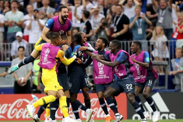 France players celebrate after France's Kylian Mbappe scores their side's fourth goal of the game.