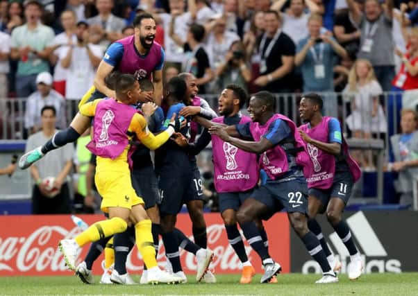 France players celebrate after France's Kylian Mbappe scores their side's fourth goal of the game.