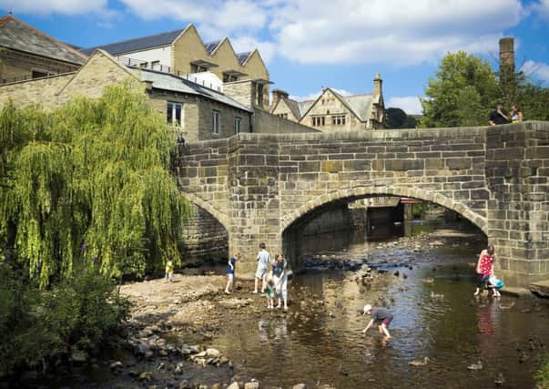 People paddling in Hebden Beck at Hebden Bridge, West Yorkshire, as hot weather continues. Has too little common sense been used in the heatwave?
