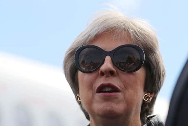 Prime Minister Theresa May, who said her controversial Brexit blueprint will safeguard millions of jobs in the aerospace industry, as she officially opened the Farnborough International Airshow in Hampshire. PA