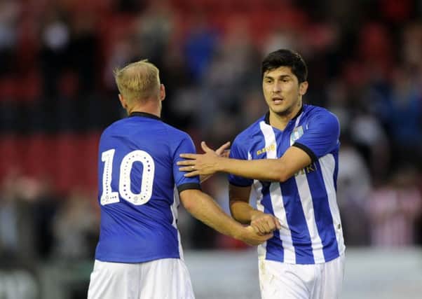 IN THE FRAME: Fernando Forestieri, right, showed an early sign of his intent for the 2018-19 season in Friday's pre-season friendly at Lincoln City. Picture: Steve Ellis.
