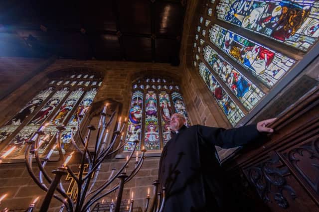 Canon Tony Macpherson, admiring the work which has been repaired so far at Wakefield Cathedral.