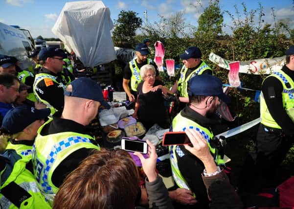 PICTURE EDITORS GUILD AWARD..REGIONAL PHOTOGRAPHER OF THE YEAR.Anti Fracking demonstators at Kirby Misperton..Police threaten to arrest tea lady Jackie Brookes from her table, if she didn't move, to enable the police to remove a tower built on the site..9th October 2017 ..Picture by Simon Hulme