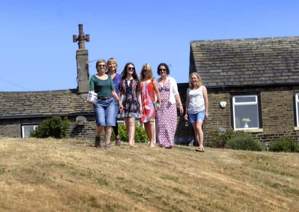 From left, Jill Liddington with descendents of Mary Taylor (above), Jan Woodward, Ellie Woodward-Webster, Beth Woodward, Sarah Wickham and Jenny Woodward, at Mary Taylors former home in Skircoat Green, Halifax. (Picture: Simon Hulme).