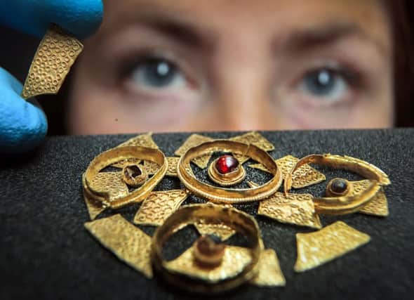 Curator of Archaeology Lucy Creighton with an seventh century Anglo-Saxon disc brooch, believed to have come from the burial of a noblewoman, that has recently been acquired by the Yorkshire Museum in York.