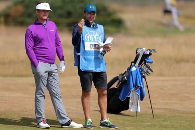 How far to the green? England's Thomas Curtis (left) and his caddie at a practice day on Wednesday. (Picture: Richard Sellers/PA Wire)