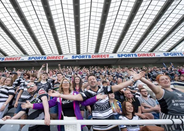 Hull FC fans celebrate their victory over Hull KR.