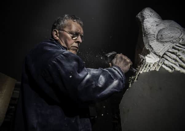 CHIPPING AWAY: Charles Gurrey carving a block of lapine limestone at his workshop in Hessay, near York, for a cathedral figure commission. PIC: James Hardisty