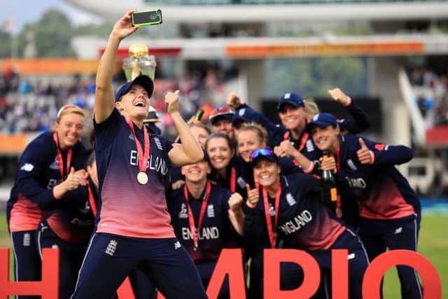 SMILE!! Katherine Brunt takes a selfie with the England team as they celebrate winning the ICC Women's World Cup Final at Lord' on July 23 last year. Picture: John Walton/PA