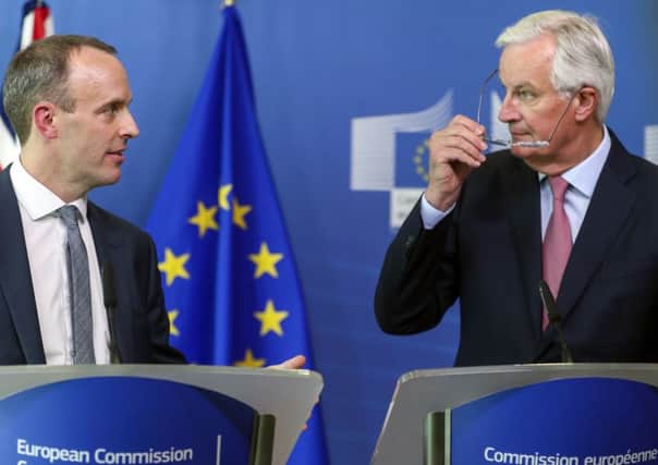 Dominic Raab, the new Brexit Secretary, in talks with his EU counterpart Michel Barnier.