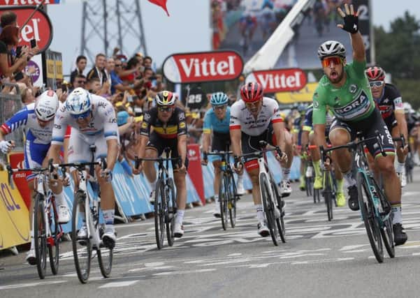 Slovakias Peter Sagan, right, crosses the finish line to win the 13th stage of the Tour de France (Picture: Christophe Ena/AP).