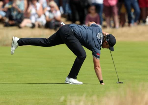 Eddie Pepperell picks his ball out of the hole during his final round of 67 at Carnoustie (Picture: David Davies/PA Wire).