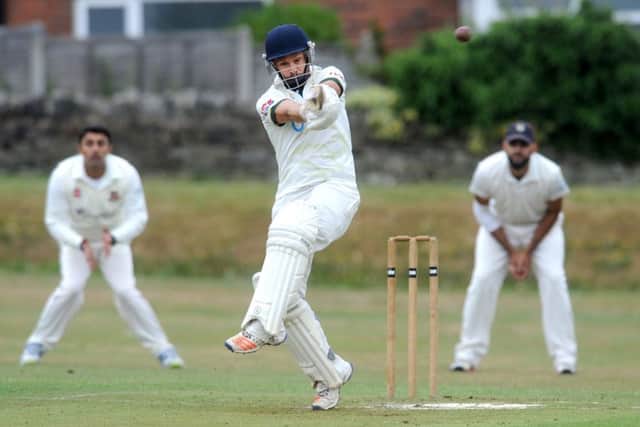 New Farnley's David Cummings pulls for four against East Bierley. Picture: Steve Riding