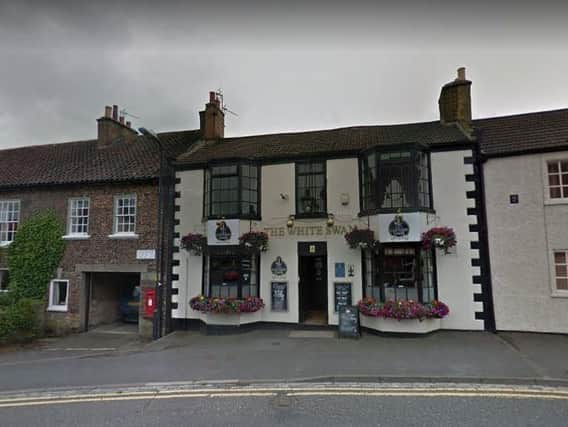 The road bike had been left secured to a lamp post outside the White Swan pub in Stokesley. Picture: Google