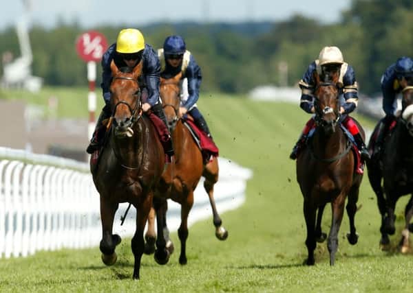 Crystal Ocean (left) ridden by Ryan Moore wins The Qatar Gordon Stakes at Goodwood in August last year. Picture: Paul Harding/PA