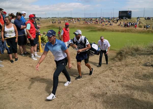 Danny Willett and his caddie walk off the second green during the final round of the Open at Carnoustie (Picture: Richard Sellers/PA Wire).