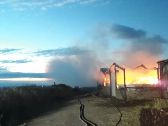 Fire crews have been tackling a blaze in farm buildings at Cumberworth