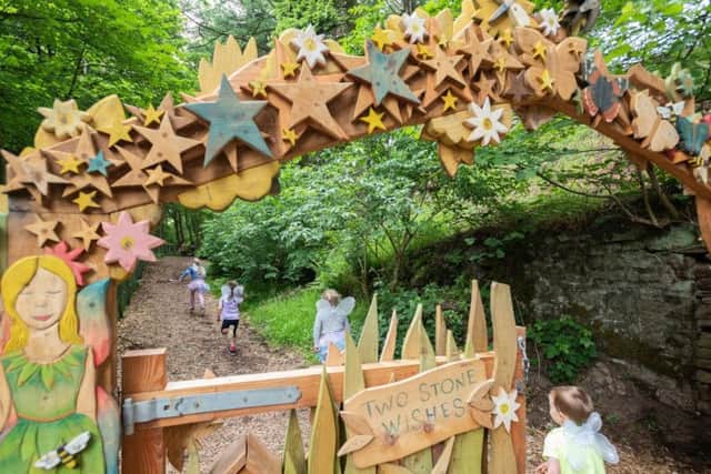 Explorers can enter the fairy village after unlocking the code to the ornate woodland-themed gate