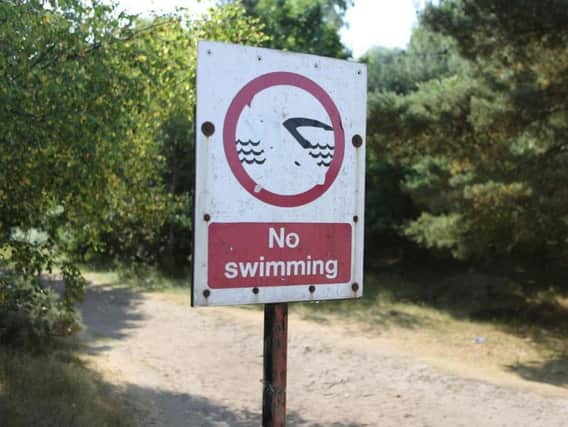 Warning signs have gone up at the lake warning people not to swim there (stock pic)