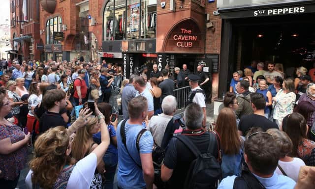 People outside the Cavern Club in Liverpool before an exclusive Sir Paul McCartney gig.