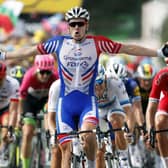 France's Arnaud Demare celebrates as he crosses the finish line to win the 18th stage of the Tour de France (Picture: Christophe Ena/AP).