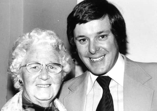 Leeds.  19th July 1978  Cinderella - for - a - day, Mrs. Alice Hawkins (88) gets a hug from her Prince Charming, Richard Whiteley, of YTV's "Calendar" at a luncheon to mark the programme's 10th anniversary.  "It's just like a fairytale," said Alice, of Lulworth Crescent, Leeds, after being greeted by Richard when she attended the luncheon at the Queen's Hotel with other Women's Circle members.  "I'm so happy I could cry," she confessed as she collected autographs from the television personalities, among them comedian Les Dawson, singer Anita Harris, former Yorkshire cricketer Fred Trueman and many of the "Calendar" team.  Alice, who has 15 great-grandchildren, had no hope of going to the luncheon because of difficulty walking.  But a magic wand was waved and a "pumpkin" was laid on.  "I'm just like Cinderella going to the ball," said a delighted Alice, wearing a dress made specially for the occasion by a granddaughter.  "Richard Whiteley is my favourite because he is so jolly.  I"ll never forget this wonderfu