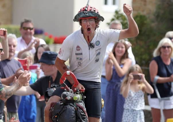 Ed Pratt, 22, returns home to Somerset after three years having travelled around the world with his unicycle.
