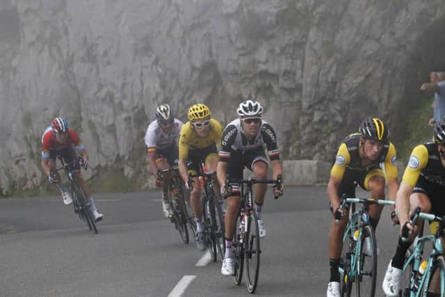 Stage winner Slovenia's Primoz Roglic, second right, follows team-mate Netherlands' Steven Kruijswijk, and is followed by Britain's Geraint Thomas, wearing the overall leader's yellow jersey. Picture: AP/Christophe Ena