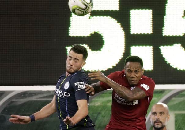 Elland Road-bound: Manchester City forward Jack Harrison, left, and Liverpool defender Nathaniel Clyne challenge in the  International Champions Cup tournament  in East Rutherford, New Jersey. Picture: AP Photo/Julio Cortez