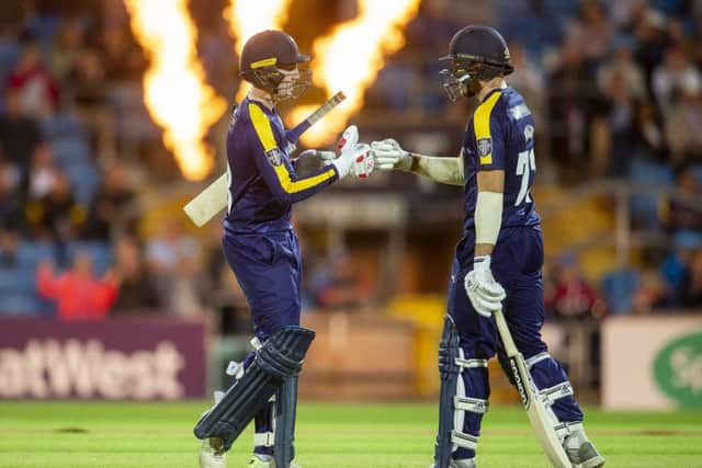FLAME THRILLED: Yorkshires Harry Brook and David Willey punch gloves against Derybshire after a boundary. But it was the visitors who prevailed by a 77-run margin. Picture: Allan McKenzie/SWpix.com