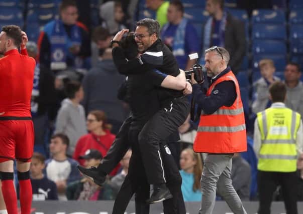 MIRACLE: David Wagner celebrates after the final whistle at Stamford Bridge after Huddersfield Town's 1-1 draw against Chelsea ensured the Terriers' Premier League survival. Picture: PA.