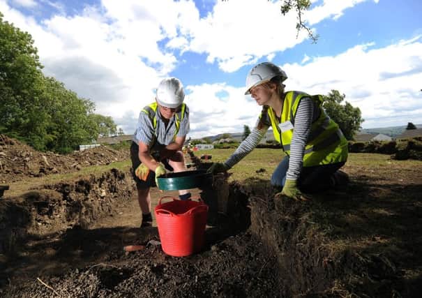 Leah Stead from Upper Wharfedale School and Alan Roberts on the dig. Picture by Simon Hulme