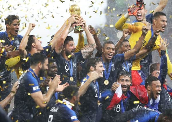 France celebrate with the trophy after winning the FIFA World Cup Final at the Luzhniki Stadium, Moscow. The 2018 tournament was hosted by Russia, who defeated England for the right to stage the tournament. (Picture: PA)