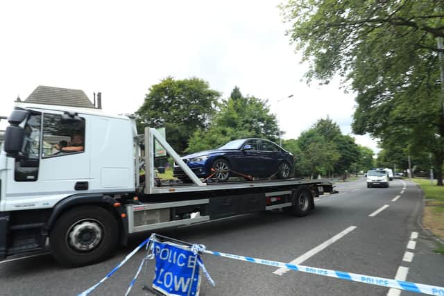 The scene of the crash in Bradford as a car is taken away. Photo: PA