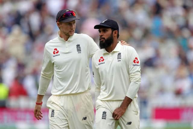 Centre of controversy: England's Adil Rashid with Joe Root.