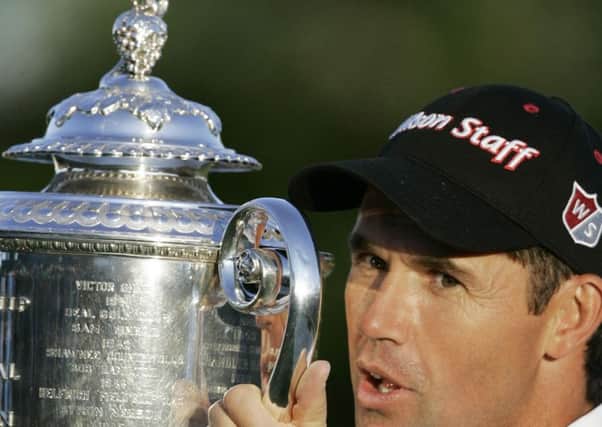 Padraig Harrington, of Ireland, holds up the Wanamaker Trophy after winning the 90th PGA Championship golf tournament Sunday, Aug. 10, 2008, at Oakland Hills Country Club in Bloomfield Township, Mich. (AP Photo/Carlos Osorio)