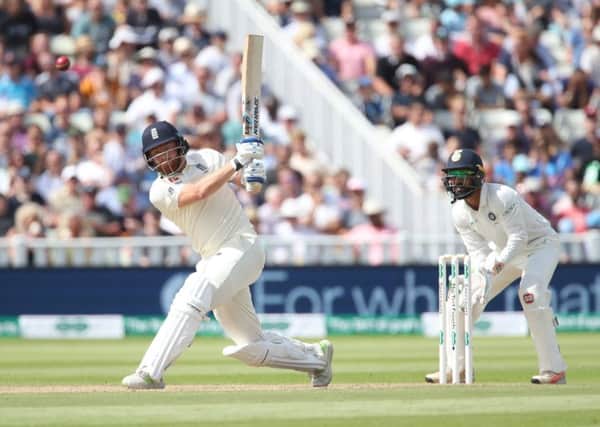 GET HIM IN ! England's Jonny Bairstow scores watched by India wicketkeeper Dinesh Karthik at Edgbaston earlier this week. Picture: Nick Potts